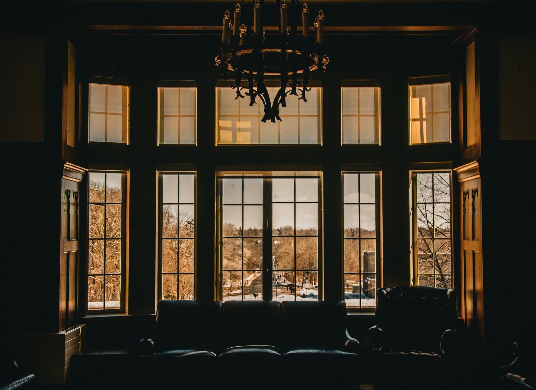 Warm living space with large windows and an outdoor view